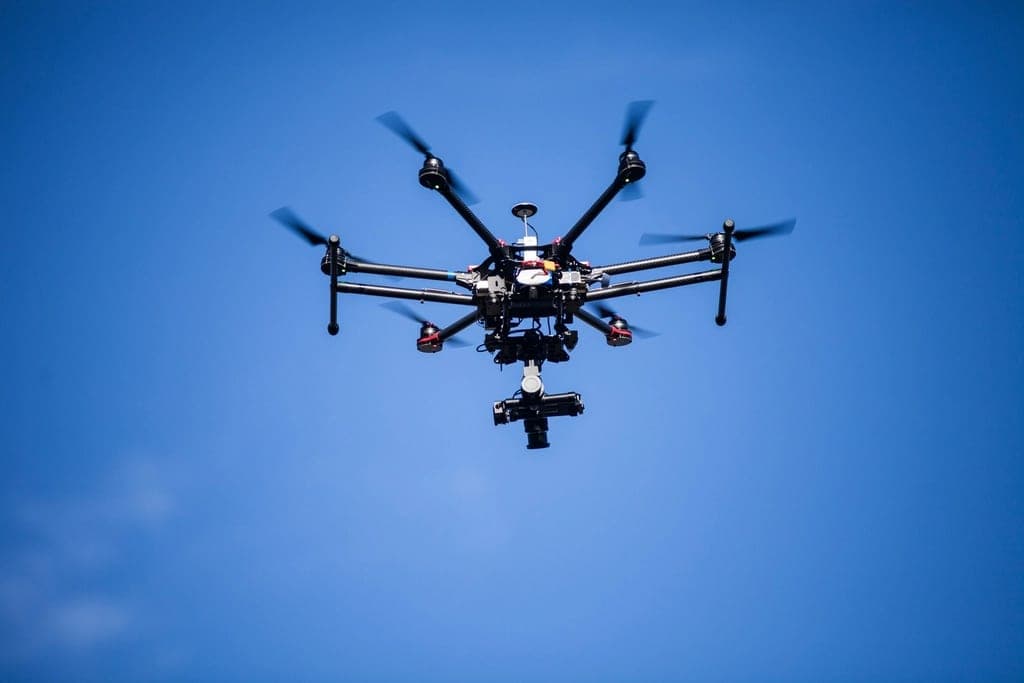 Survey hexacopter with a gimbal-mounted camera in flight