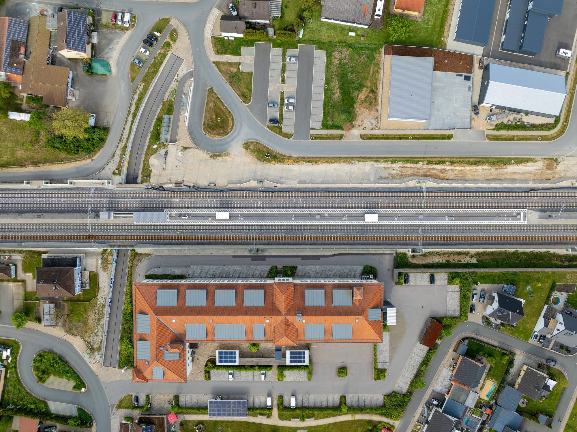 Raw aerial capture over a rail corridor